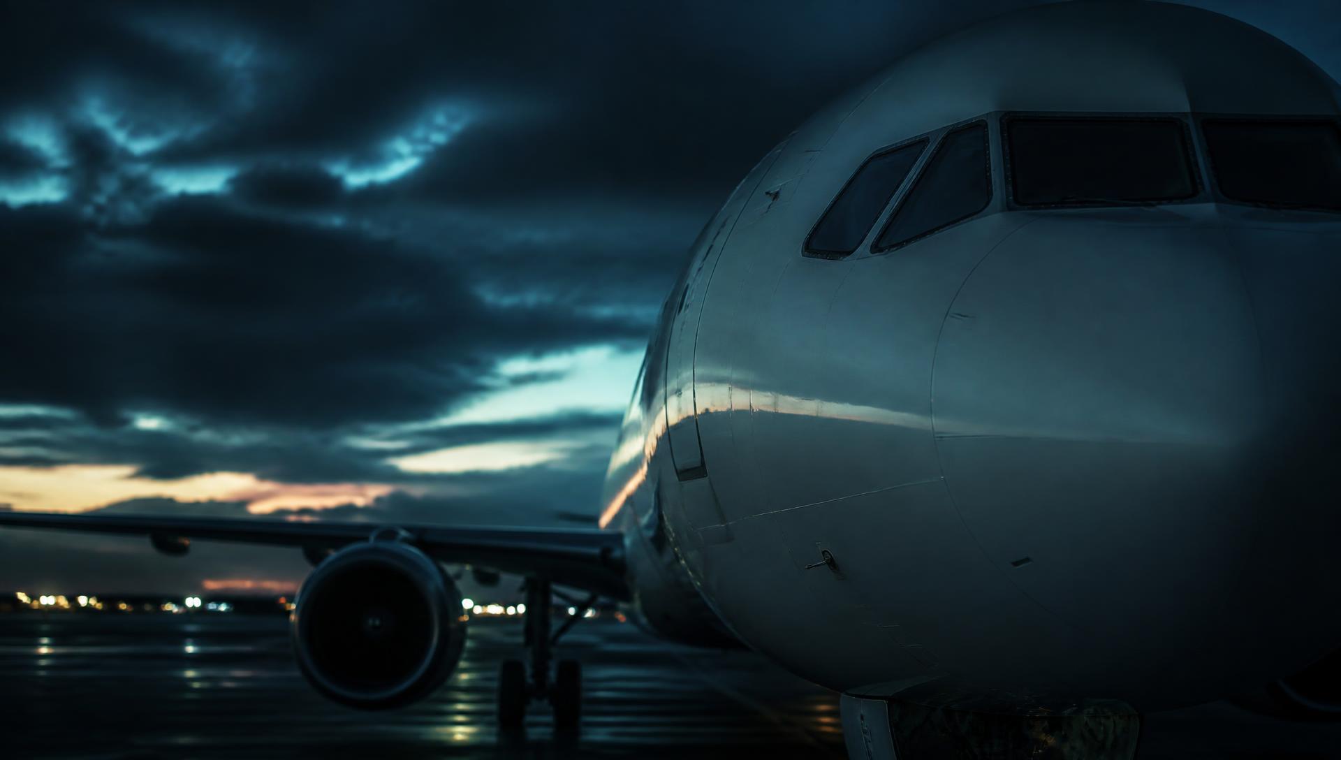 Commercial aircraft on the apron at dusk
